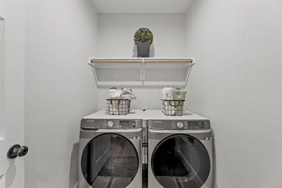 Laundry room featuring separate washer and dryer