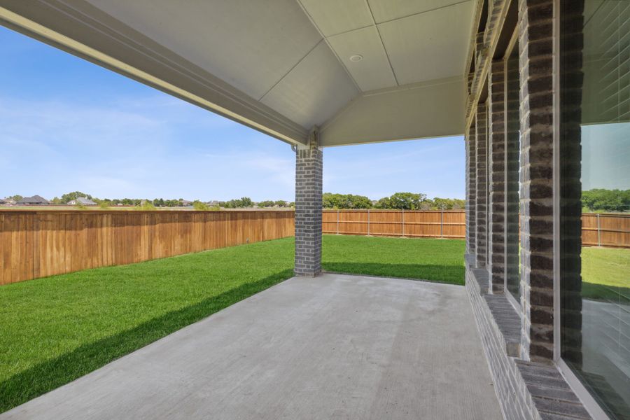 Covered Patio in the Henley home plan by Trophy Signature Homes – REPRESENTATIVE PHOTO