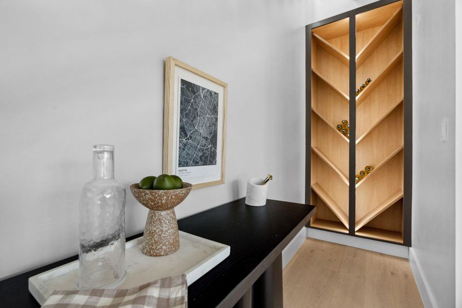 Sleek and stylish wine storage elegantly tucked beneath the staircase.