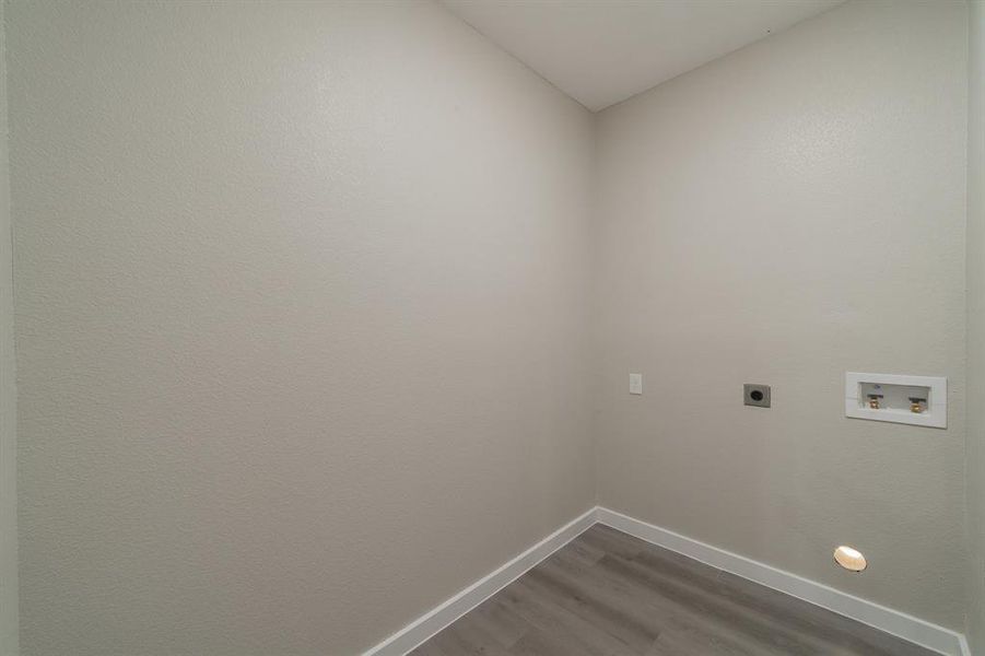 Laundry Room with wood-type flooring, electric dryer hookup, and hookup for a washing machine