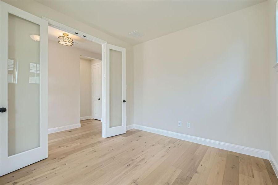 Spare room featuring light hardwood / wood-style floors