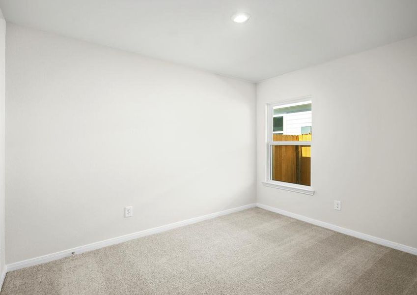 One of two additional bedrooms with its own closet.