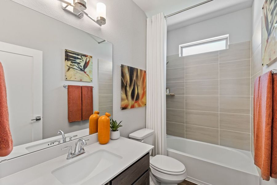Bathroom in the Mercury II home plan by Trophy Signature Homes – REPRESENTATIVE PHOTO