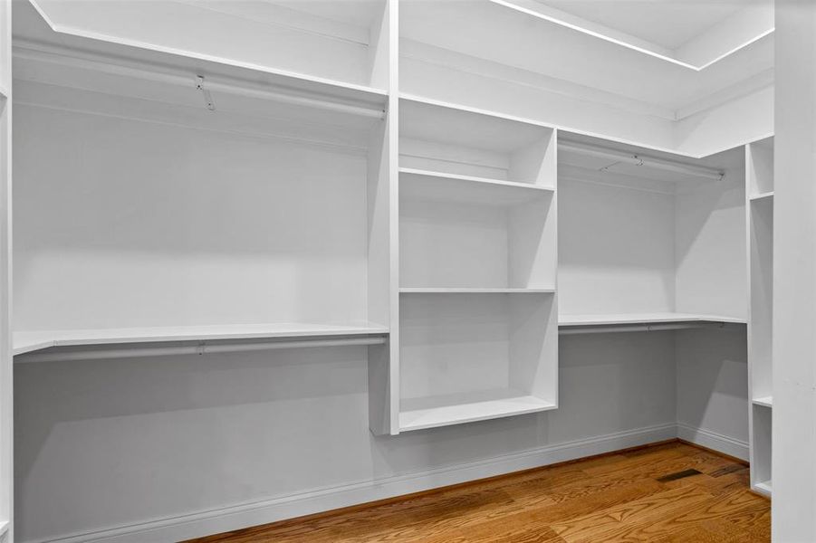 Walk in closet featuring wood-type flooring