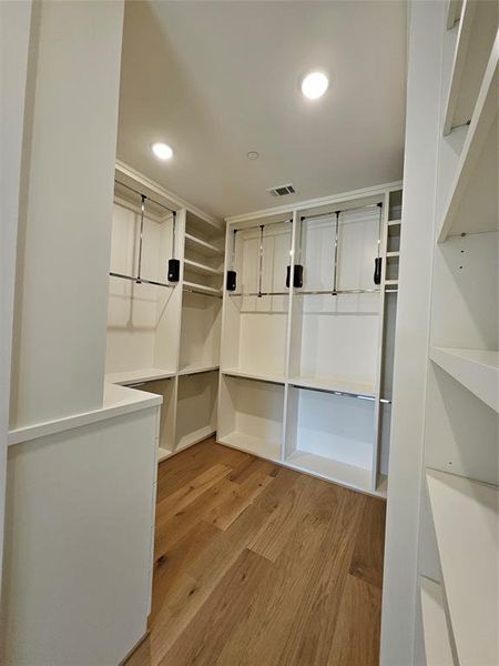 Primary Walk-In-Closets with pull-down rods