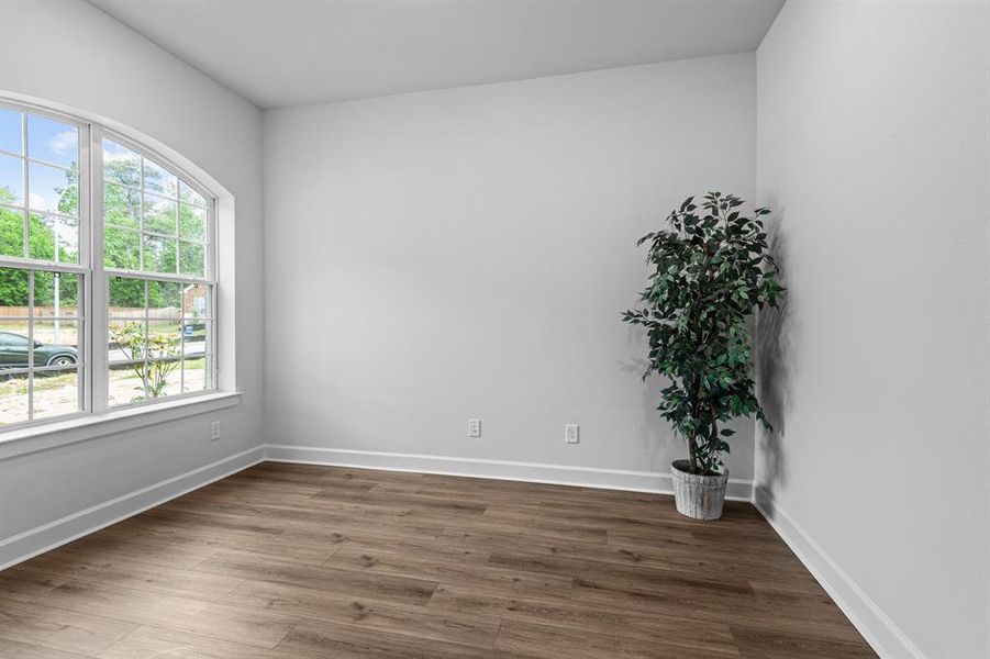 EXAMPLE PHOTO:  Open study with high ceilings, vinyl plank floors and a big window!