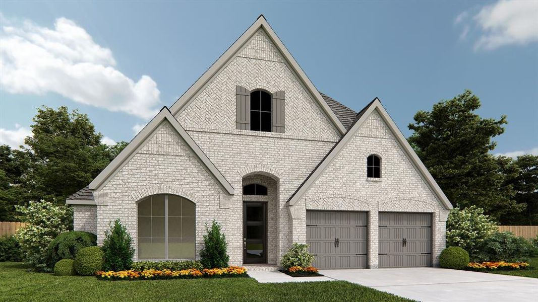 French country style house with a front yard and a garage