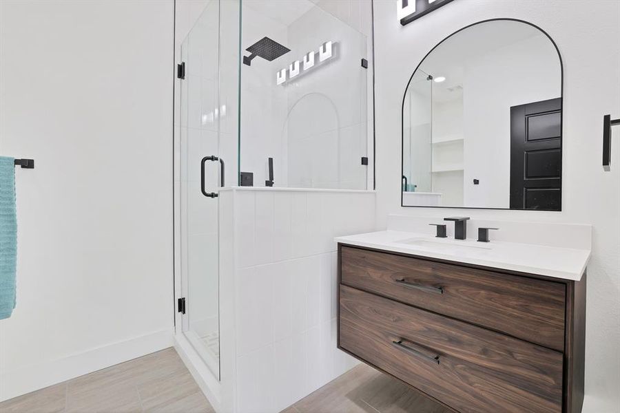 Bathroom with vanity and an enclosed shower