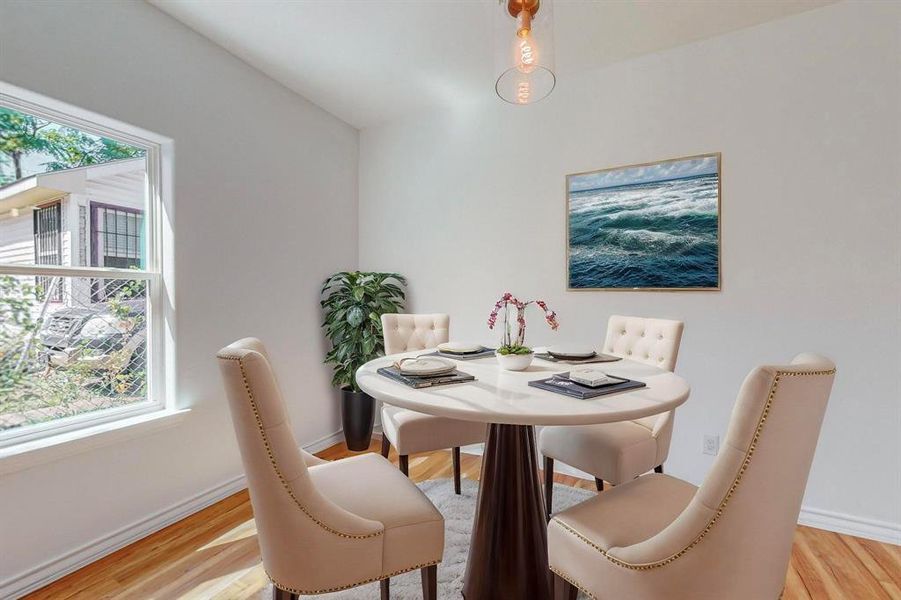 Virtually Staged - Dining area featuring light wood-type flooring