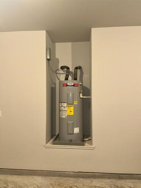 Hot water heater is in the garage for easy access