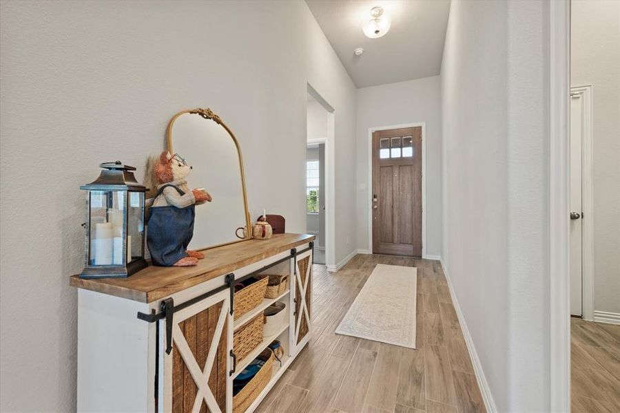 Looking into foyer and featuring the 8' front door