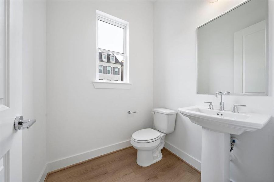 The second floor powder room is conveniently located just off the living/kitchen area.