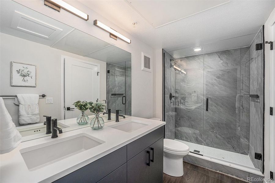 Similar unit staged; 2 sink primary bathroom