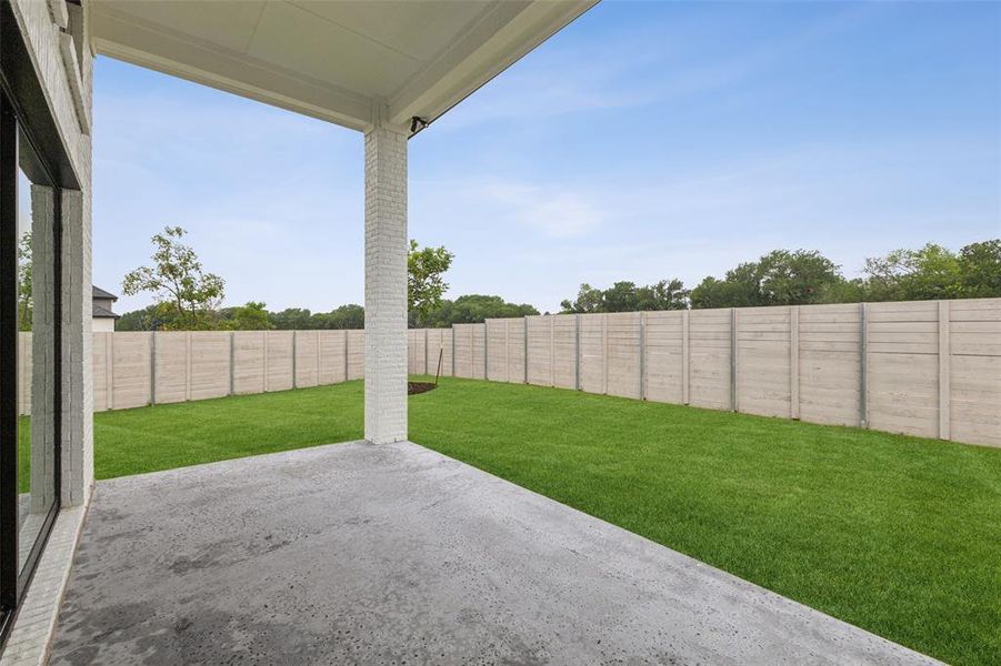 Dining al fresco is in your future on this spacious, covered back patio!