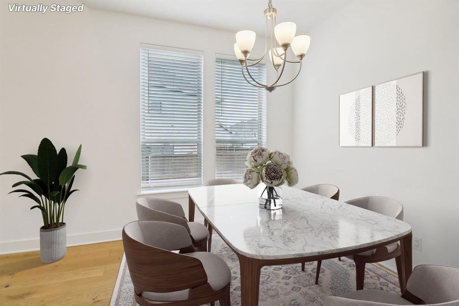 Dining area with a chandelier and hardwood / wood-style floors