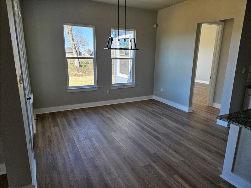 Breakfast area open to kitchen and living room