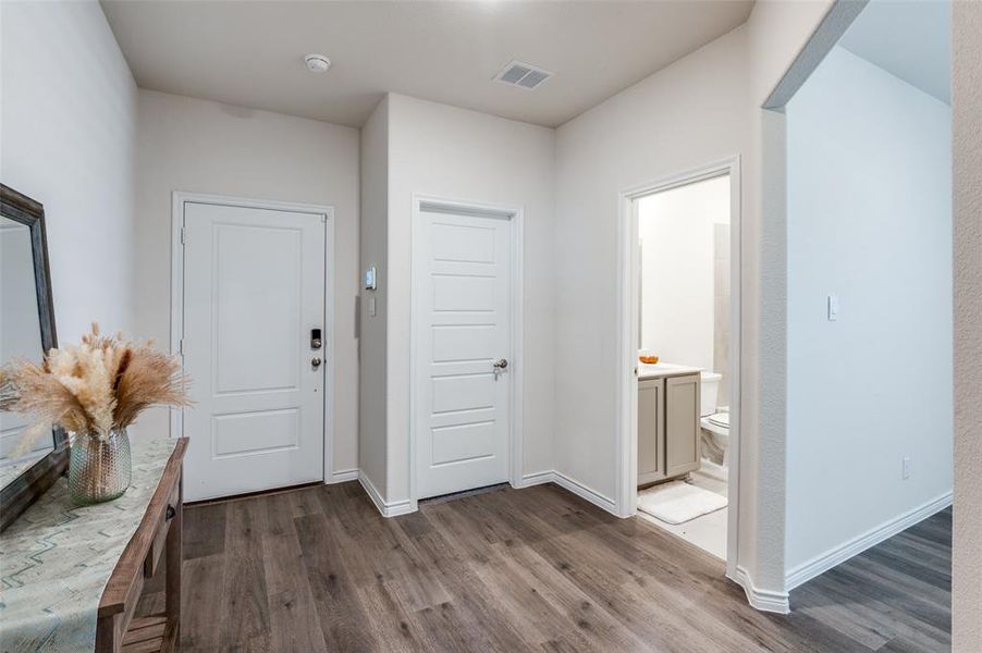 Entrance foyer featuring dark hardwood / wood-style flooring