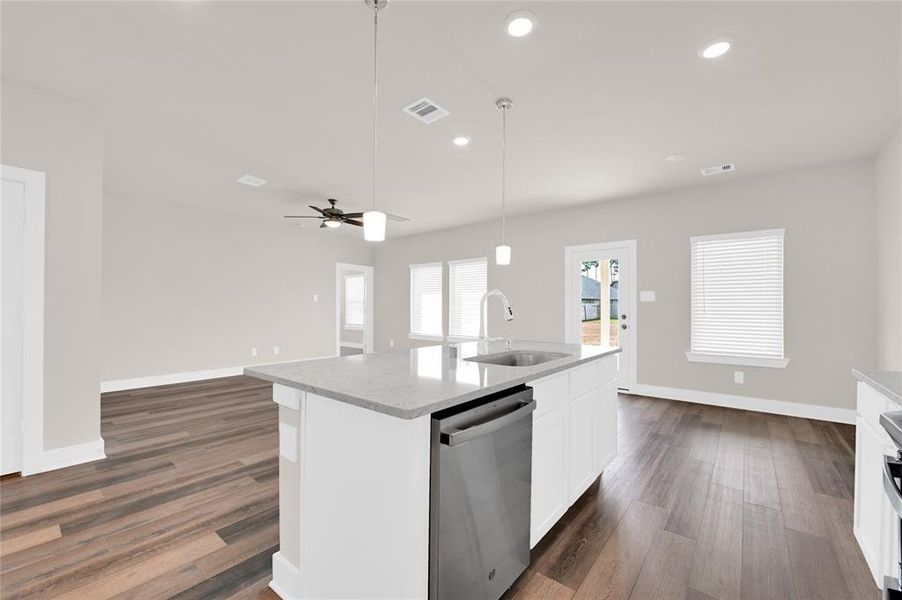 The quartz island is perfectly placed for entertaining guests. Or watch your favorite sports team while scrubbing the dishes! The kitchen island is large enough to place 3-4 barstools.