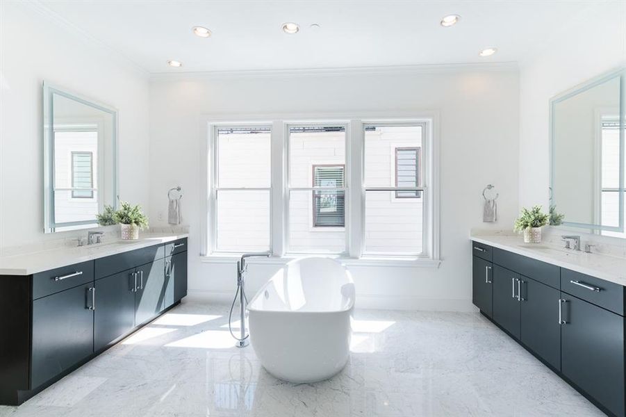 Walk into your Primary bathroom with floating tub, large freestanding shower and separate vanities with LED mirrors. 2 large walk-in closets.