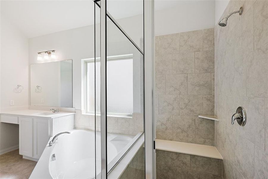 Bathroom with vanity, plus walk in shower, and tile patterned floors