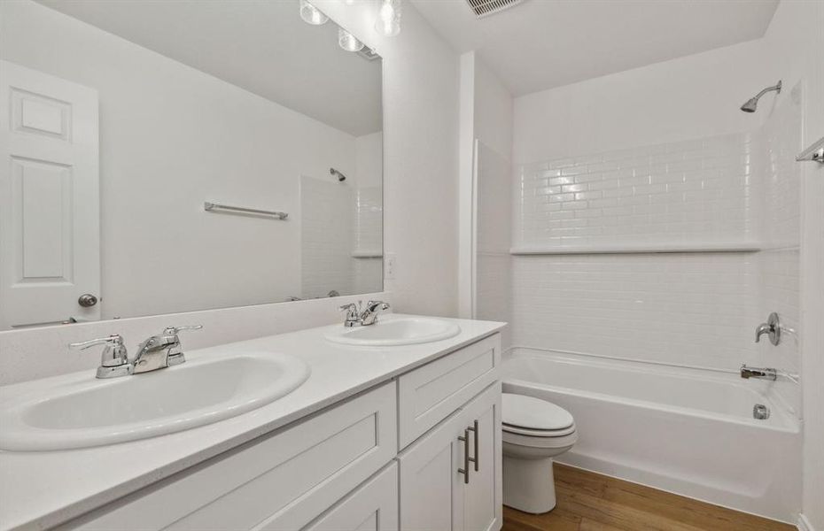 Upgraded secondary bathroom *real home pictured