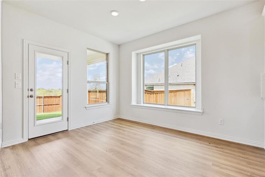 Spare room featuring light wood-type flooring