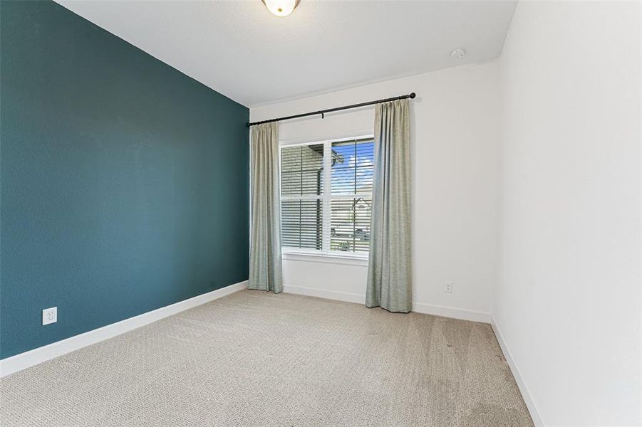 This bright and cheerful bedroom is front and center! With windows facing the front of the home, you’ll enjoy plenty of natural light and a great view of the neighborhood.