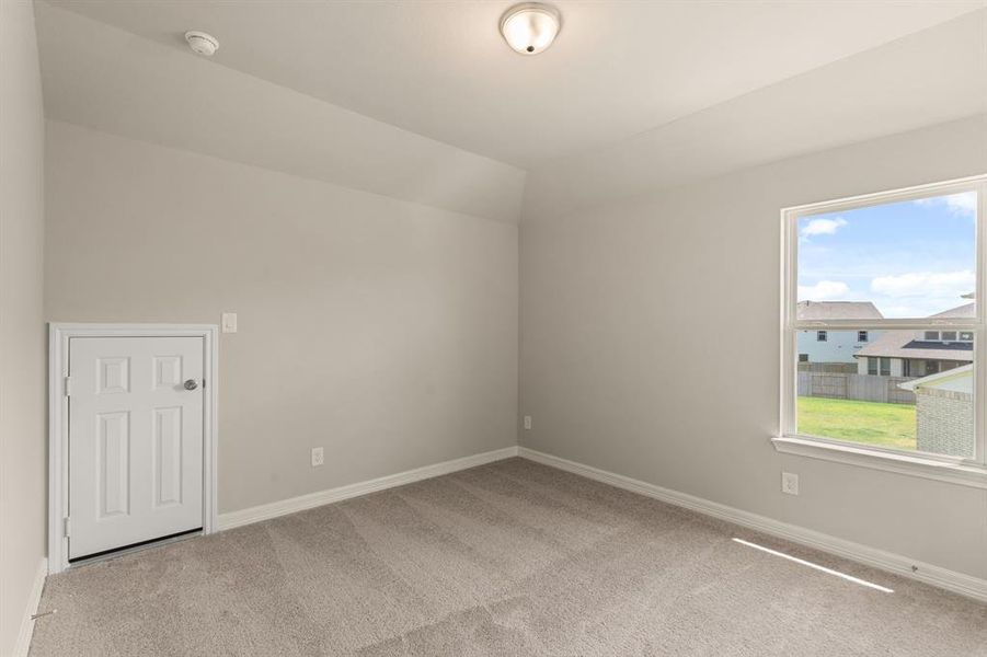 Your secondary bedroom features plush carpet, fresh paint, closet, and a large window that lets in plenty of natural lighting.