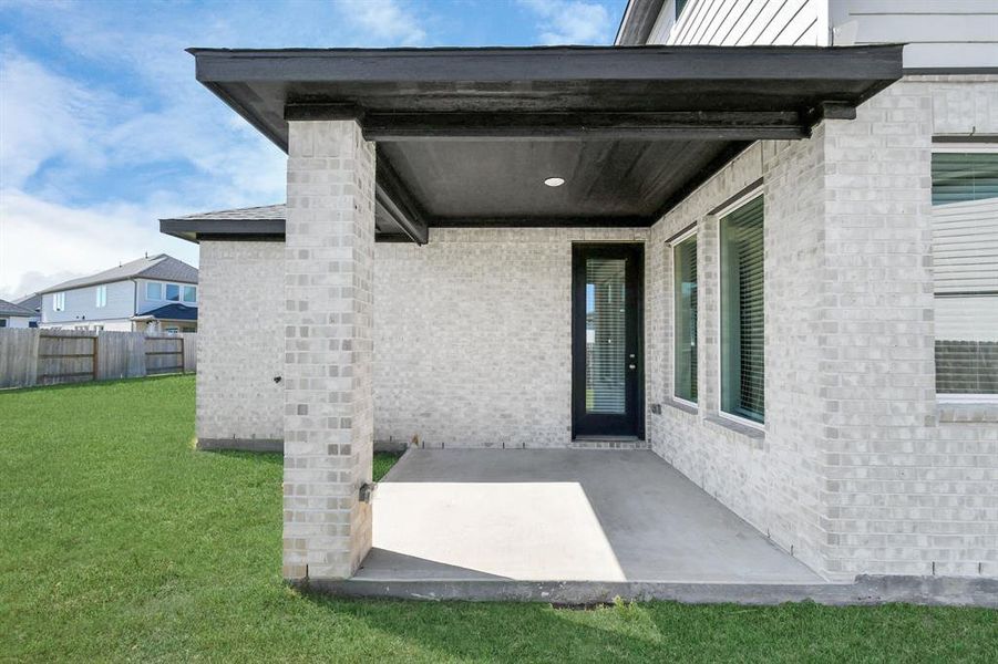 Charming covered patio, perfect for relaxing and enjoying the outdoors year-round.