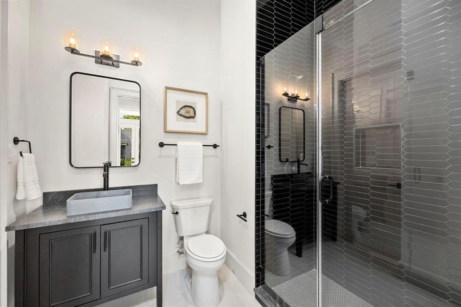 1st Floor full bath w/ public & private entrance offers sleek selections & walk-in shower.