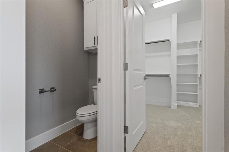 Bathroom featuring tile patterned floors and toilet