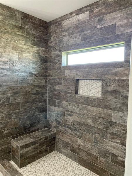 Bathroom with a tile shower