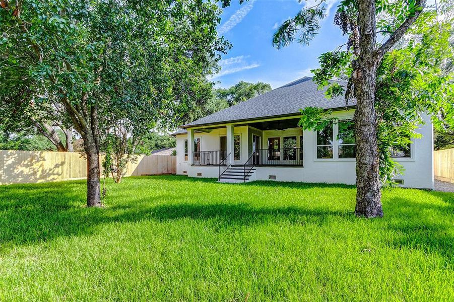 This large outdoor space features mature trees and a lush lawn. A dream for the gardener, an outdoor enthusiast, a pool or a playscape!