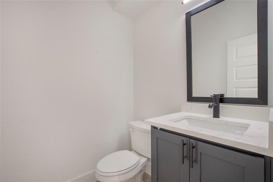 Bathroom featuring toilet and vanity