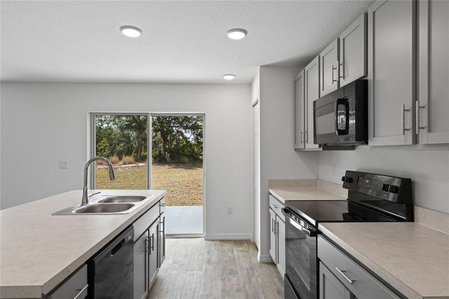 Kitchen area with easy access to back yard