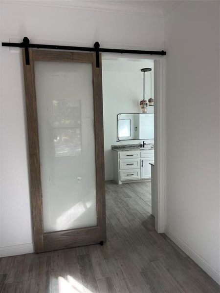 Picture meant to demonstrate comparable finishes planned- Barn door at master bath