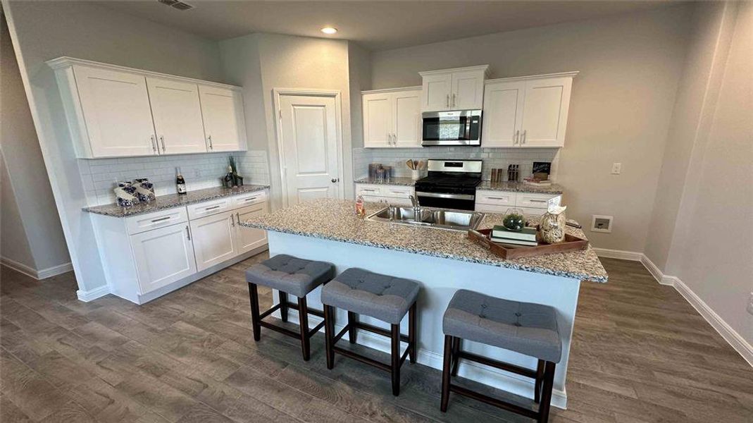 Kitchen - All Home and community information, including pricing, included features, terms, availability and amenities, are subject to change at any time without notice or obligation. All Drawings, pictures, photographs, video, square footages, floor plans, elevations, features, colors and sizes are approximate for illustration purposes only and will vary from the homes as built.