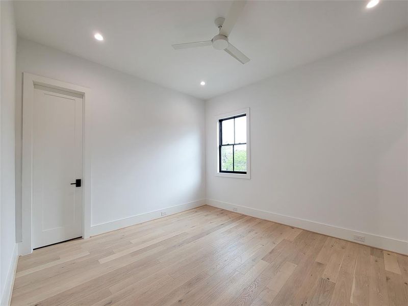 One of 3 second floor guest bedrooms with en-suite bath and walk-in closet.