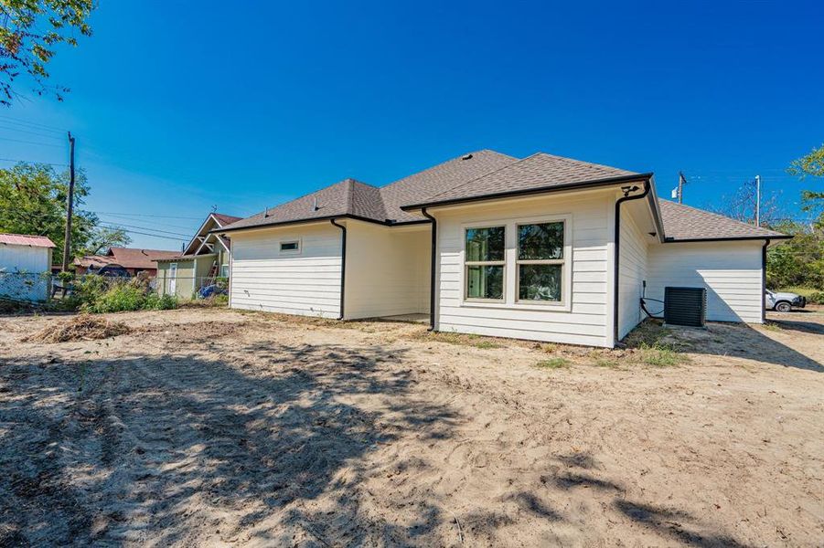 Rear view of property with central air condition unit