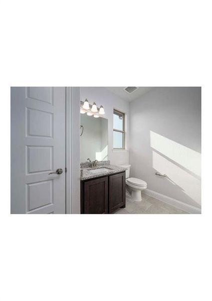 Bathroom with vanity and toilet