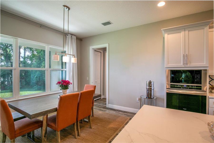 Dining area towards bath and bedroom currently utilized as an office space.