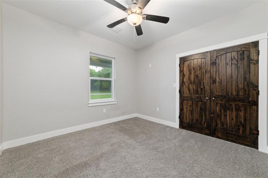 Large dark wooden double doors elegantly welcome you into this versatile room. Whether you envision it as a spare bedroom, game room, or media room, there's ample potential to customize it to meet your unique needs and interests.