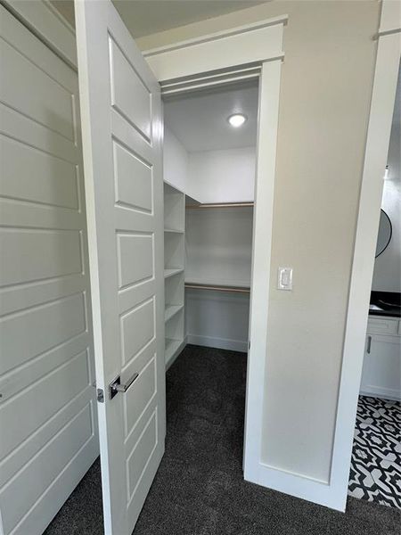 Smaller master with walk in closet, attached bathroom with 3 windows