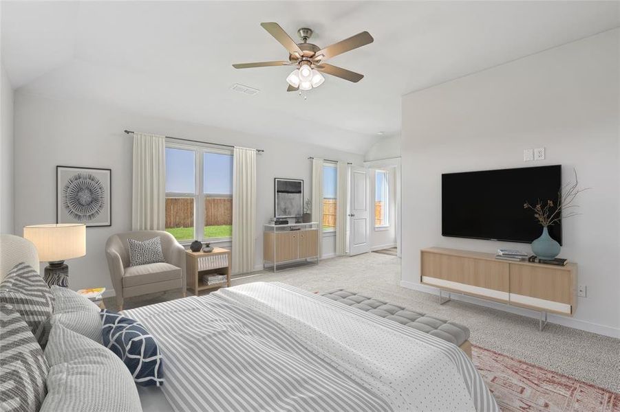 Bedroom with lofted ceiling, carpet flooring, and ceiling fan