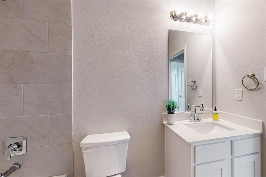 Bathroom with vanity and toilet