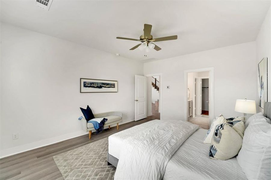 Bedroom featuring hardwood / wood-style flooring and ceiling fan