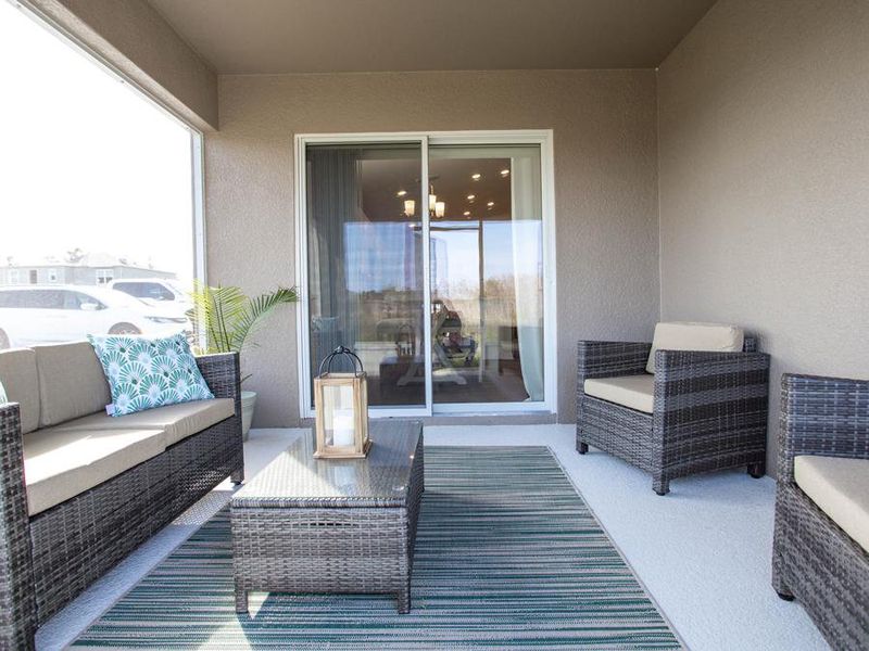 Take in the fresh Florida air on your covered lanai - Parker by Highland Homes