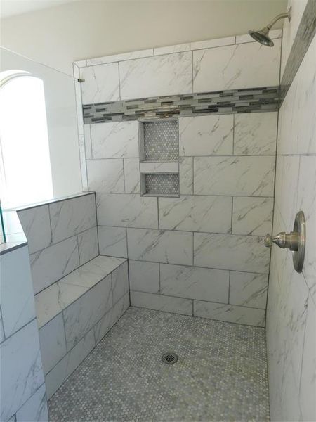 Spacious primary shower.