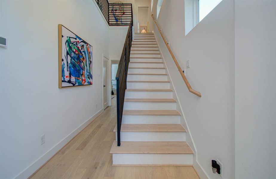 as soon as you walk in, you are greeted with a double ceiling entry foyer that makes  a grand enterace