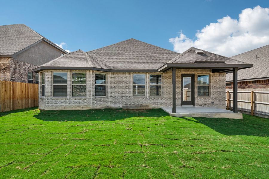 Back exterior of the the FItzhugh floorplan in a Meritage Homes community.